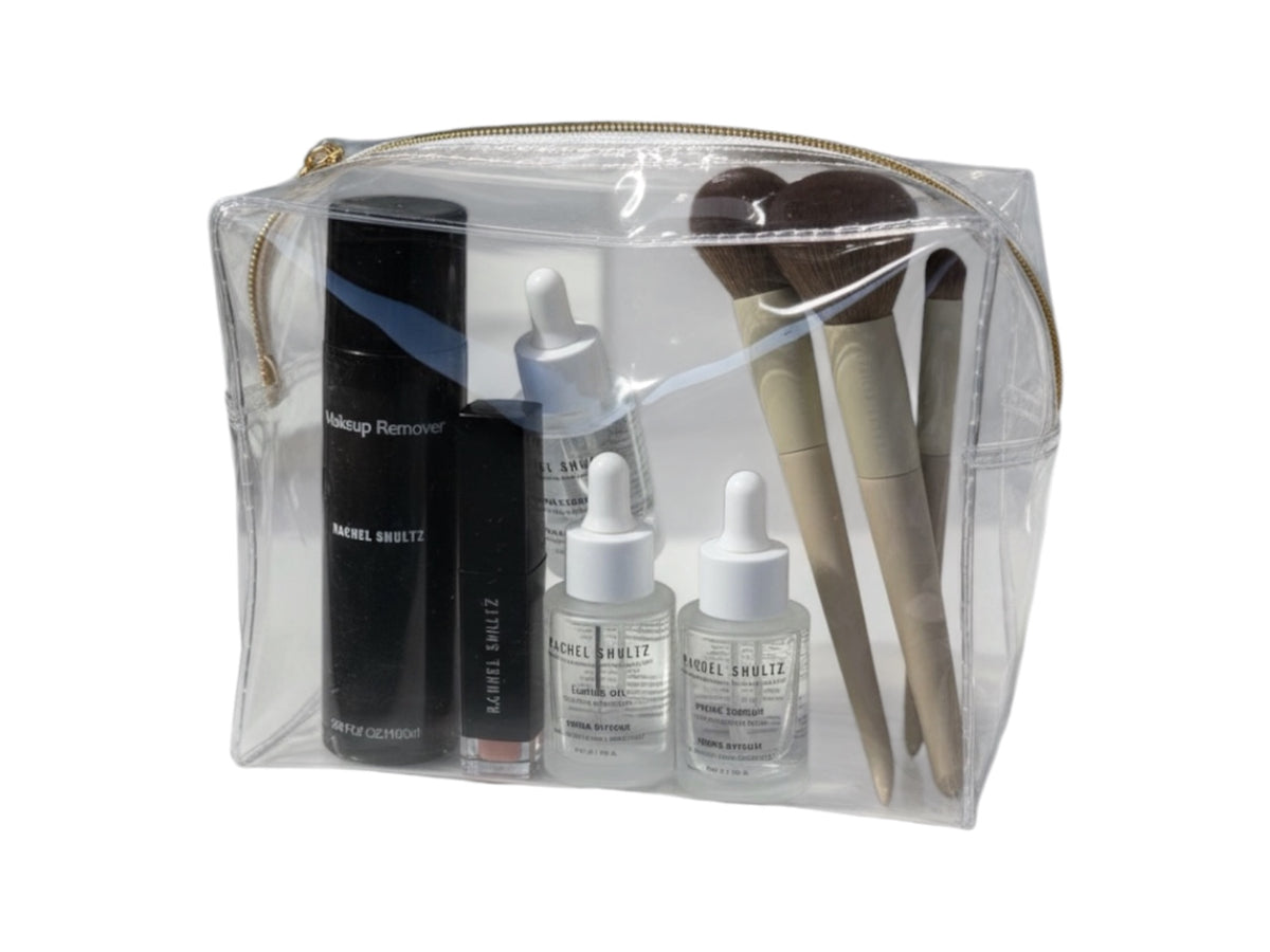Rachel Shultz skincare set in a clear cosmetic bag with makeup remover, serums and brushes